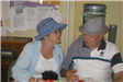 Woman and Man Wearing Blue and Tan Hats