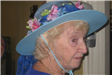 Woman Wearing Blue Hat with Flowers