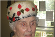 Woman Wearing White Hat with Red Leaves
