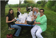 Group of Women Sitting with Food
