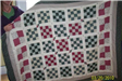 Woman Holding Red and Blue Quilt