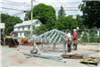 People Constructing a Roof