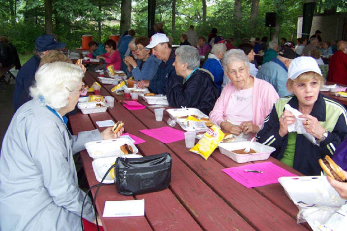 Seniors Eating at an Outdoor Picnic 3