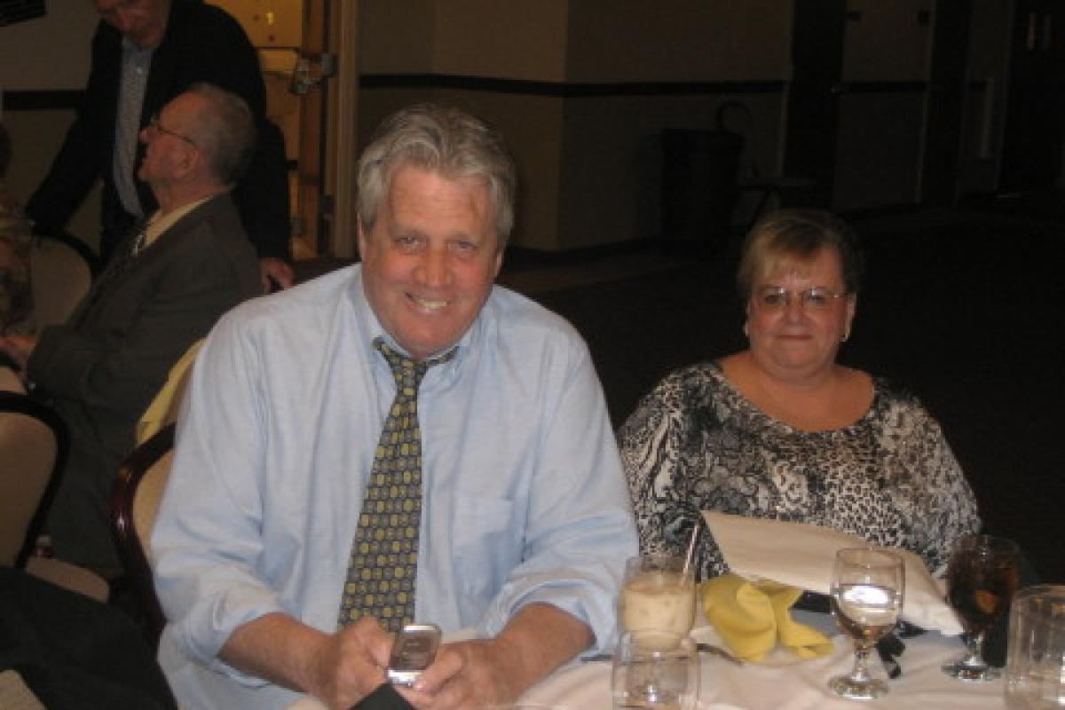 Two People Sitting and Smiling