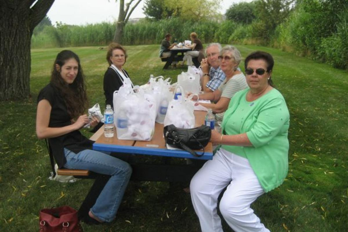 Group of Women Sitting with Food