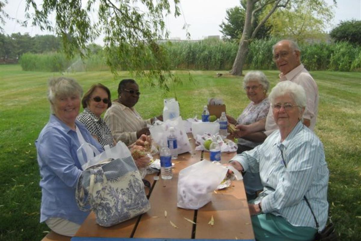 Group of Women Sitting with Food 2