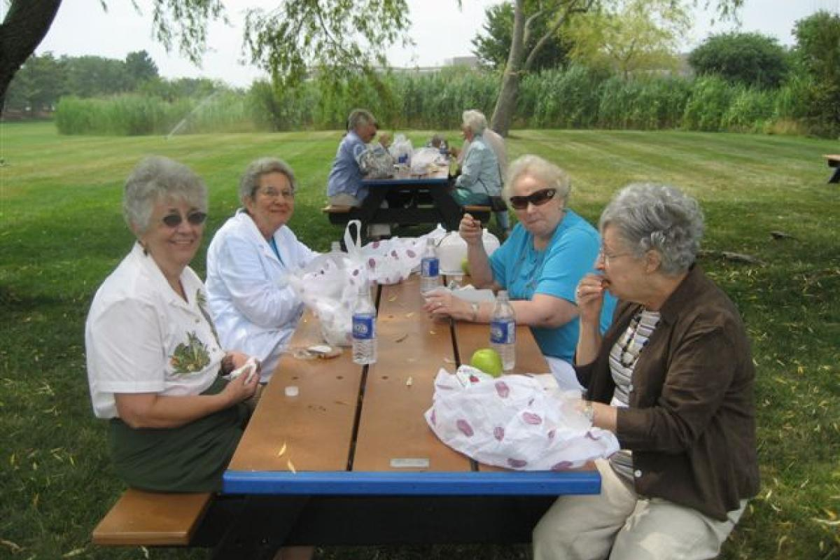 Group of Women Sitting with Food 3