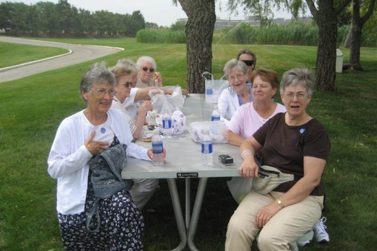Group of Women Sitting with Food 5