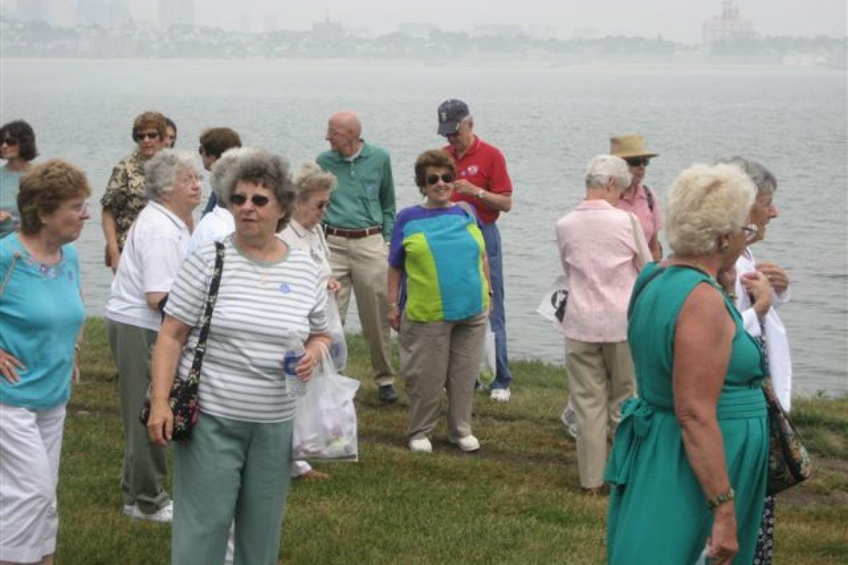 Group Standing by the Water