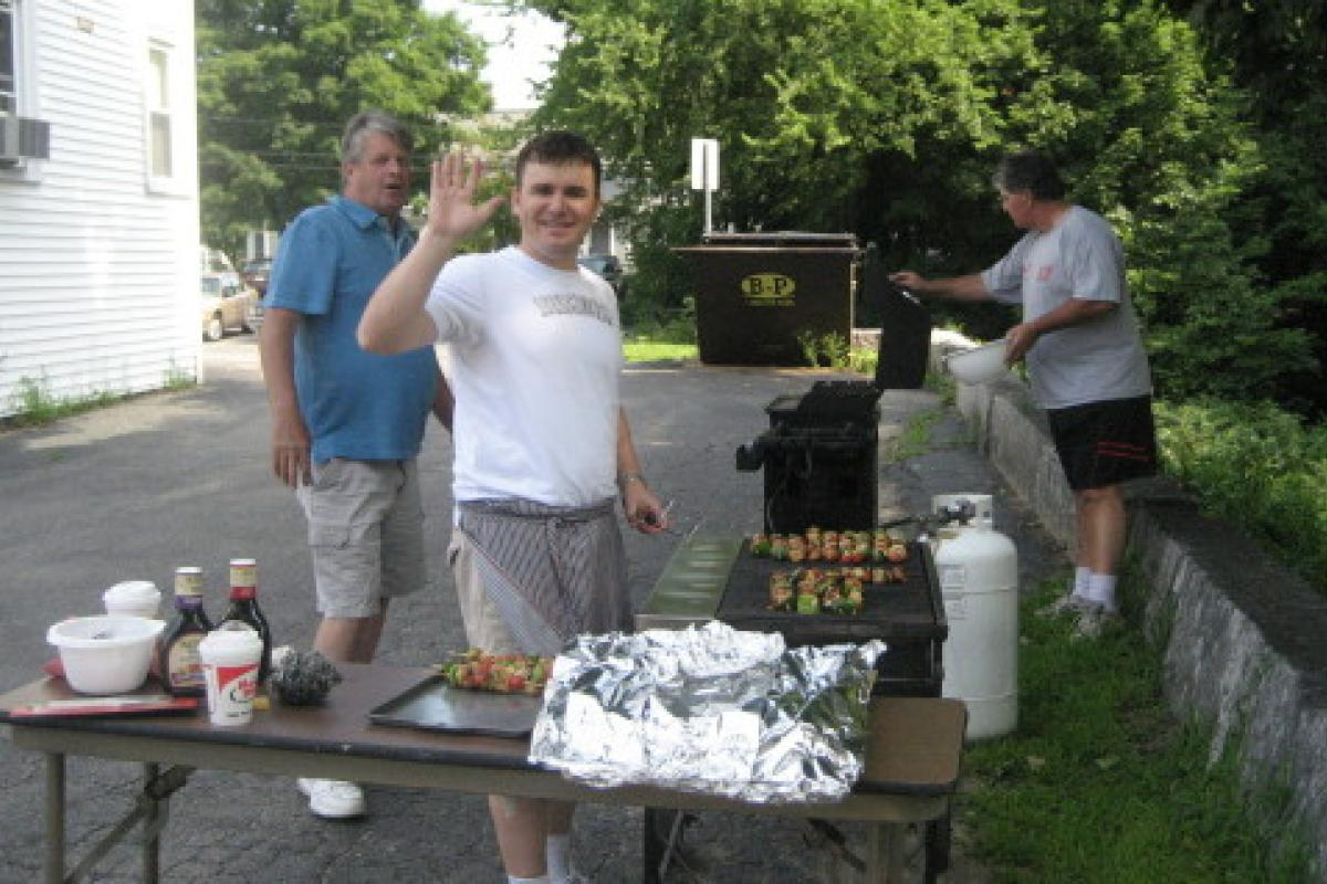 Three People Grilling