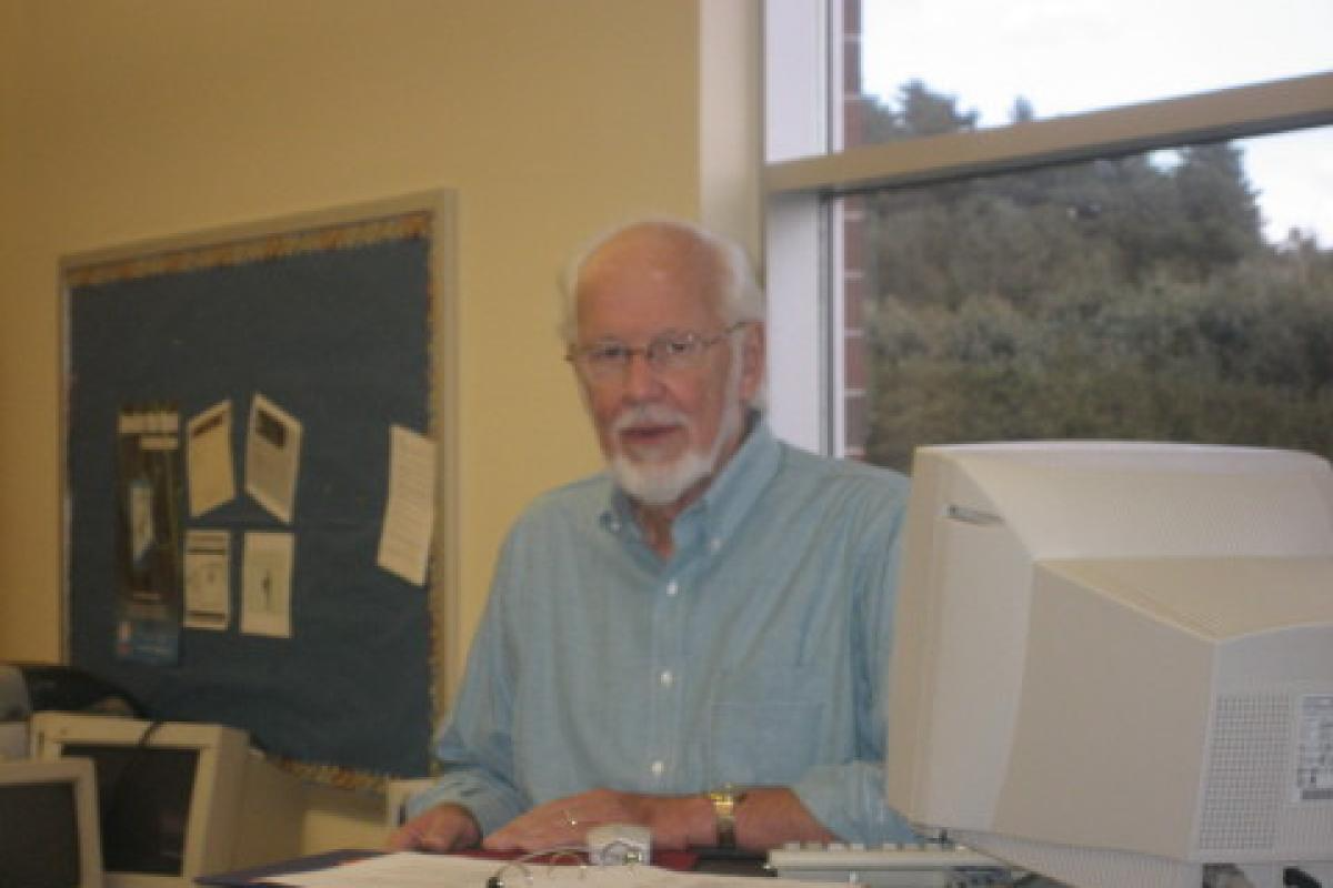 Man Sitting at a Computer