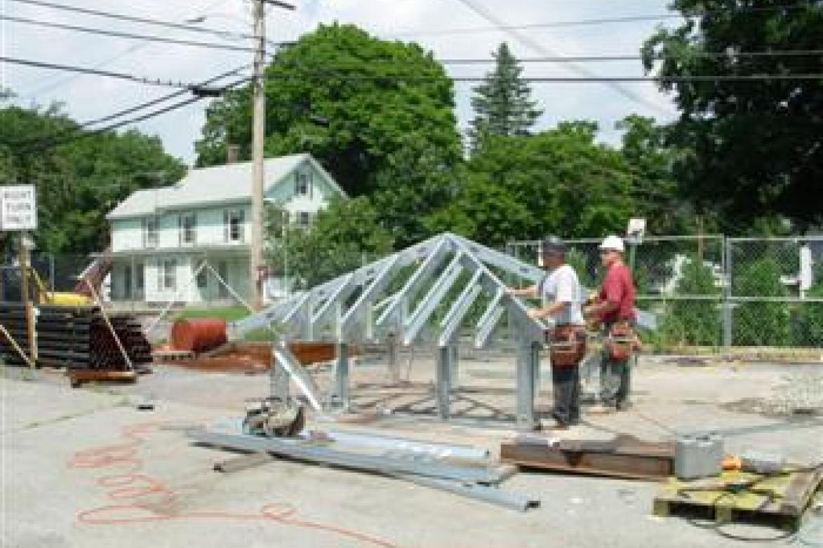 People Constructing a Roof