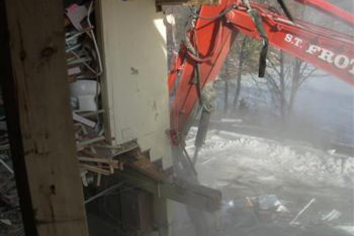 Excavator Next to Wall